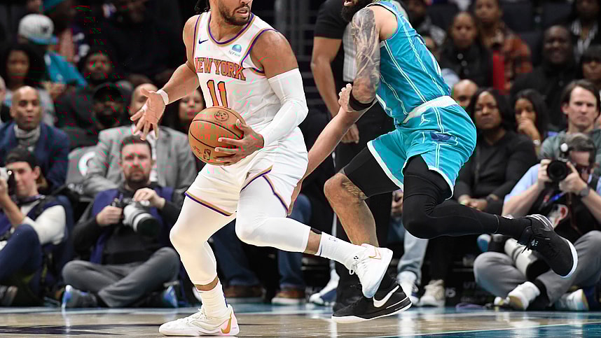 New York Knicks guard Jalen Brunson (11) moves past Charlotte Hornets forward Cody Martin (11) during the second half at the Spectrum Center