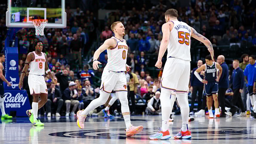 New York Knicks guard Donte DiVincenzo (0) celebrates with New York Knicks center Isaiah Hartenstein (55) after scoring during the second half against the Dallas Mavericks at American Airlines Center