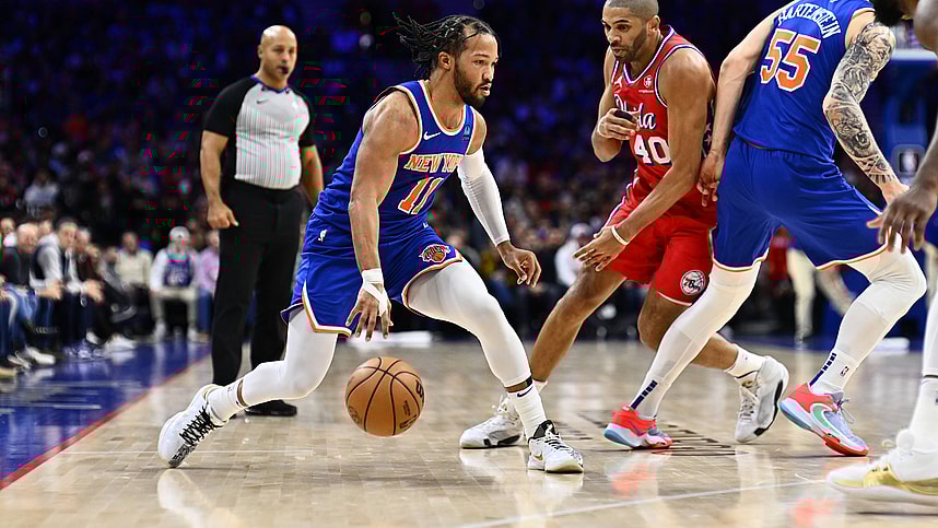 New York Knicks guard Jalen Brunson (11) controls the ball against the Philadelphia 76ers in the first quarter at Wells Fargo Center