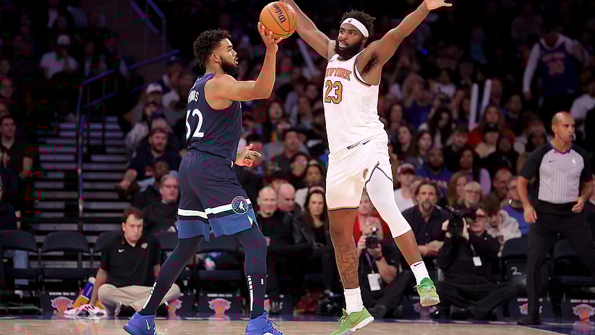 Minnesota Timberwolves center Karl-Anthony Towns (32) looks to pass the ball against New York Knicks center Mitchell Robinson (23) during the third quarter at Madison Square Garden