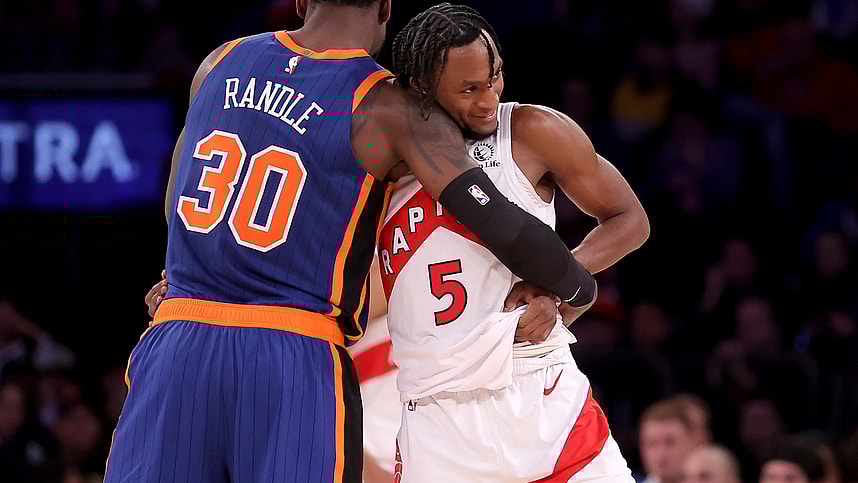 Toronto Raptors guard Immanuel Quickley (5) hugs New York Knicks forward Julius Randle (30) after being substituted out of the game during the fourth quarter at Madison Square Garden