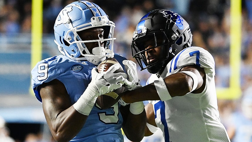 North Carolina Tar Heels wide receiver Devontez Walker (9) (New York Giants prospect) catches the ball as Duke Blue Devils cornerback Al Blades Jr. (7) defends in the first quarter at Kenan Memorial Stadium