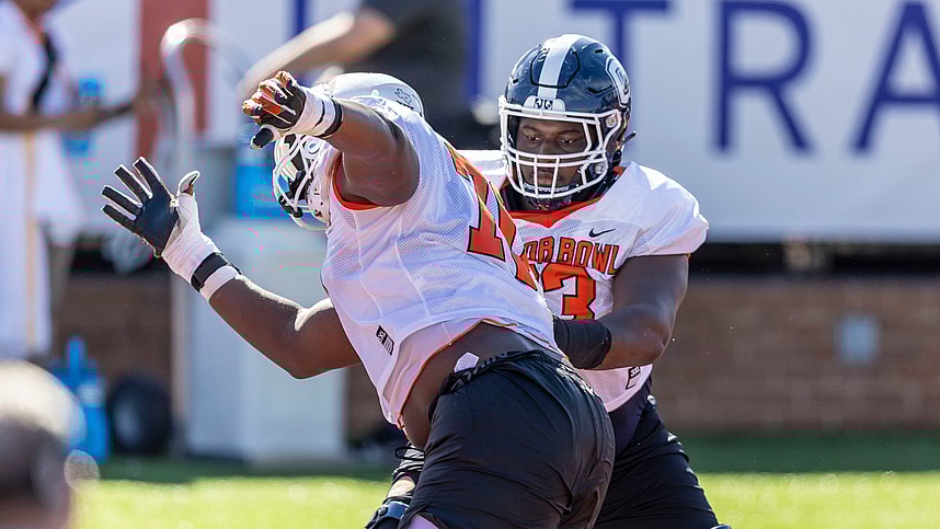 American offensive lineman Christian Haynes of Uconn (63) (New York Giants prospect) faces off against American offensive lineman Christian Jones of Texas (70) during practice for the American team at Hancock Whitney Stadium