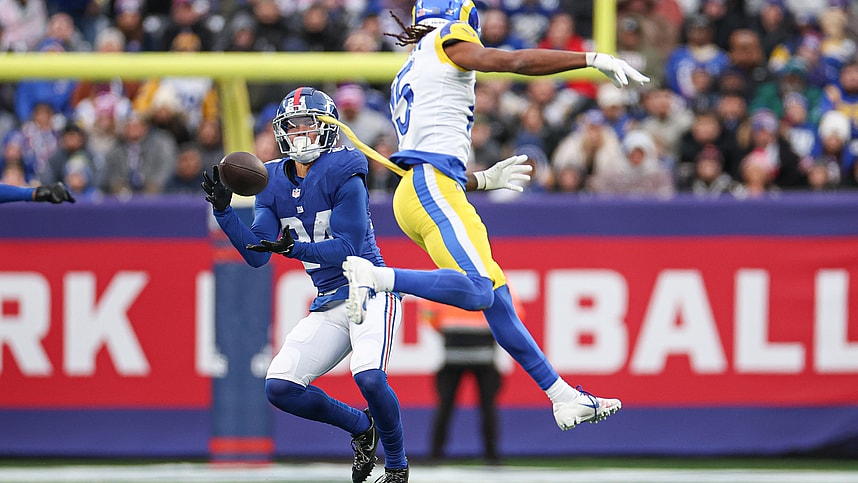 New York Giants safety Dane Belton (24) intercepts a pass intended for Los Angeles Rams wide receiver Demarcus Robinson (15) during the second half at MetLife Stadium