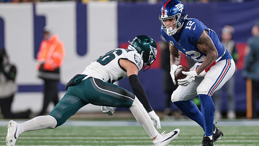 New York Giants tight end Darren Waller (12) makes a catch in front of Philadelphia Eagles safety Tristin McCollum (36) during the second half at MetLife Stadium