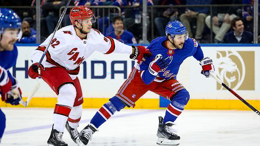 New York Rangers center Vincent Trocheck (16) and Carolina Hurricanes center Jesperi Kotkaniemi (82) chase the puck during the first period at Madison Square Garden