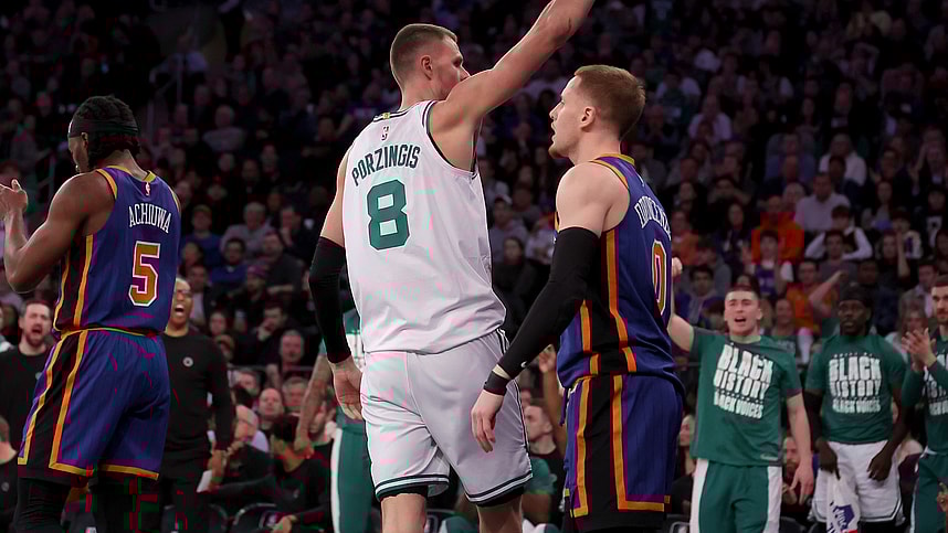 Boston Celtics center Kristaps Porzingis (8) celebrates his basket against New York Knicks guard Donte DiVincenzo (0) during the second quarter at Madison Square Garden