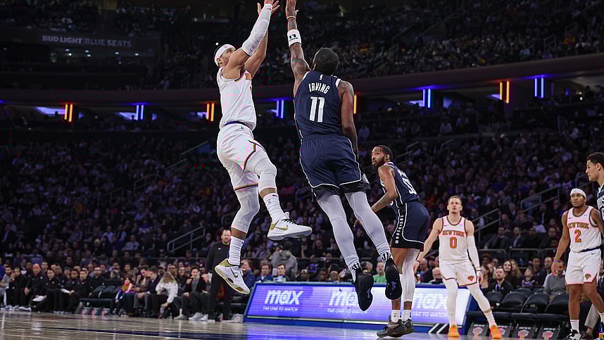 New York Knicks guard Josh Hart (3) shoots as Dallas Mavericks guard Kyrie Irving (11) defends during the second half at Madison Square Garden