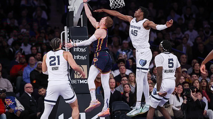 New York Knicks guard Donte DiVincenzo (0) shoots a lay up for a basket during the fourth quarter as Memphis Grizzlies forward GG Jackson (45) defends at Madison Square Garden