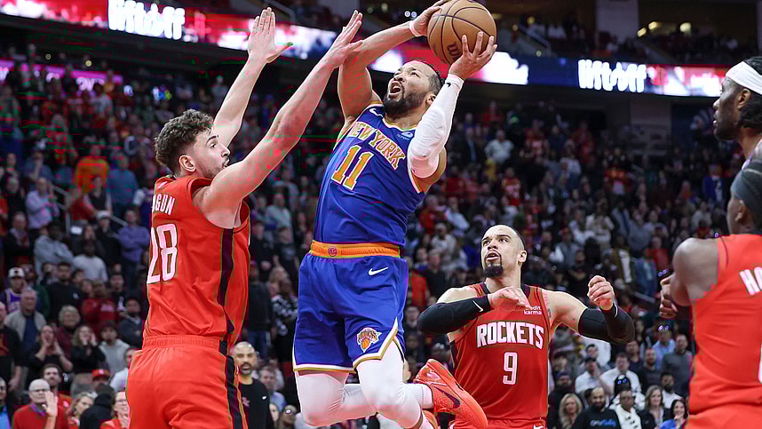 New York Knicks guard Jalen Brunson (11) attempts to score as Houston Rockets center Alperen Sengun (28) defends during the fourth quarter at Toyota Center