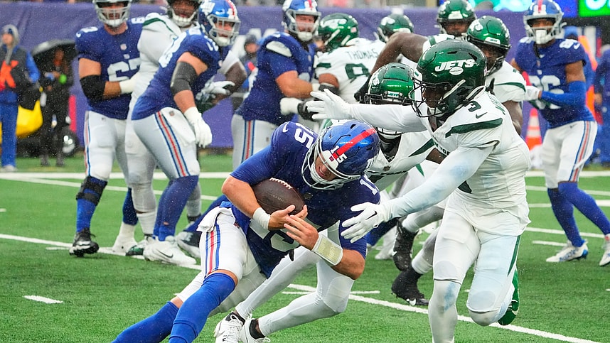New York Jets safety Jordan Whitehead (3) tackles New York Giants quarterback Tommy DeVito (15) in the fourth quarter at MetLife Stadium