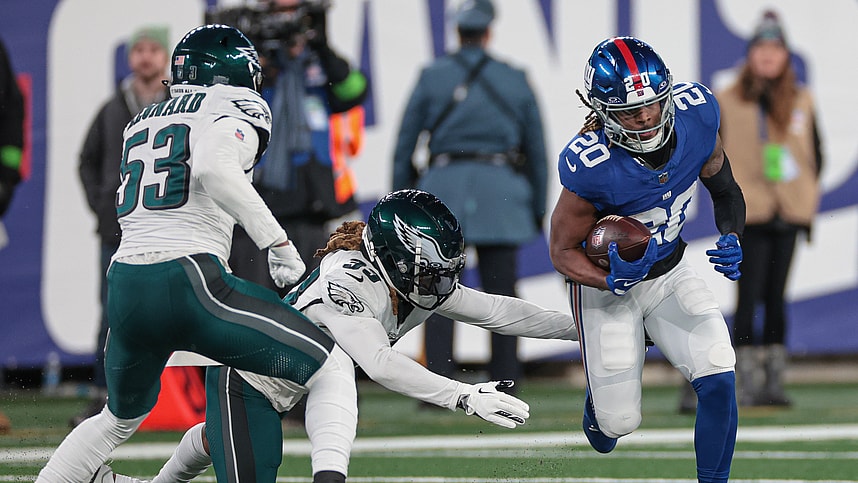 New York Giants running back Eric Gray (20) carries the ball as Philadelphia Eagles cornerback Bradley Roby (33) and linebacker Shaquille Leonard (53) pursue during the second half at MetLife Stadium