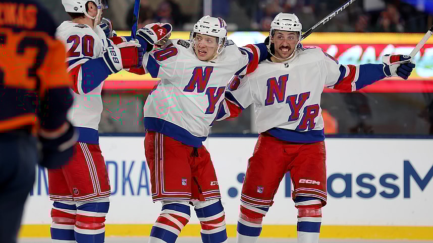 New York Rangers left wing Chris Kreider (20) celebrates his goal against the New York Islanders with left wing Artemi Panarin (10) and center Vincent Trocheck (16) during the third period of a Stadium Series ice hockey game at MetLife Stadium