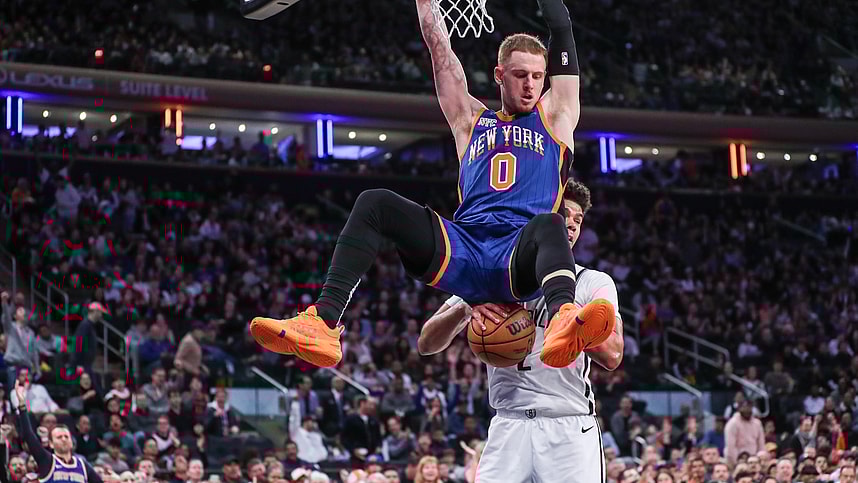 New York Knicks guard Donte DiVincenzo (0) dunks in front of Brooklyn Nets forward Cameron Johnson (2) in the fourth quarter at Madison Square Garden