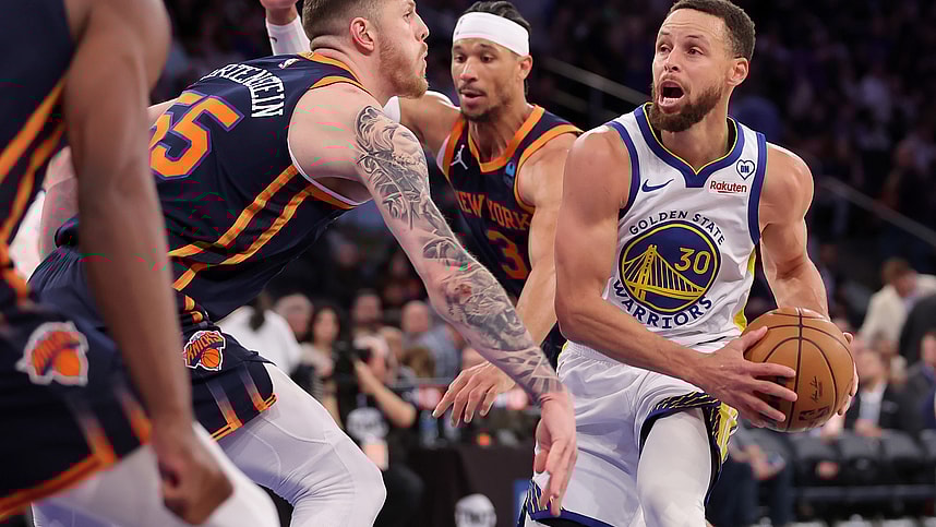 Golden State Warriors guard Stephen Curry (30) looks to pass the ball against New York Knicks center Isaiah Hartenstein (55) and guard Josh Hart (3) during the third quarter at Madison Square Garden