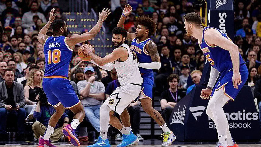 Denver Nuggets guard Jamal Murray (27) controls the ball under pressure from New York Knicks guard Alec Burks (18) and guard Miles McBride (2) as center Isaiah Hartenstein (55) defends in the fourth quarter at Ball Arena
