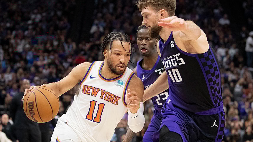 New York Knicks guard Jalen Brunson (11) dribbles the basketball against Sacramento Kings forward Domantas Sabonis (10) during the second quarter at Golden 1 Center
