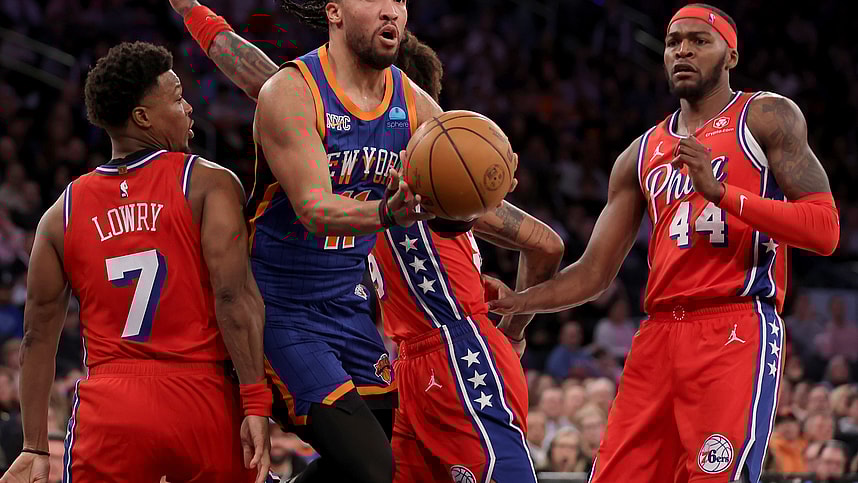 New York Knicks guard Jalen Brunson (11) looks to pass the ball against Philadelphia 76ers guards Kyle Lowry (7) and Kelly Oubre Jr. (9) and forward Paul Reed (44) during the third quarter at Madison Square Garden