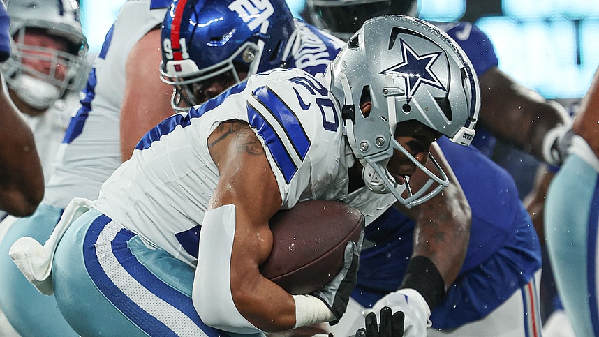 Dallas Cowboys running back Tony Pollard (20) carries the ball as New York Giants defensive tackle A'Shawn Robinson (91) tackles during the first quarter at MetLife Stadium