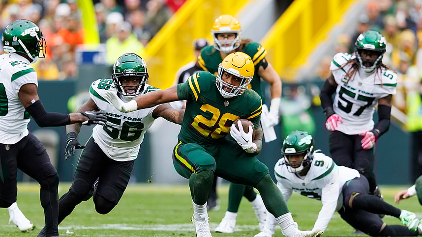Green Bay Packers running back AJ Dillon (28) rushes with the football during the third quarter against the New York Jets at Lambeau Field