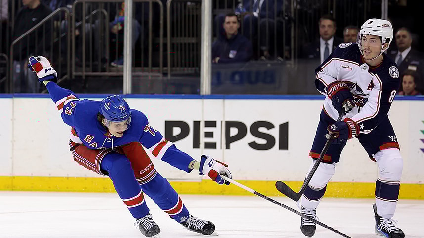 Columbus Blue Jackets defenseman Zach Werenski (8) plays the puck against New York Rangers center Matt Rempe (73) during the second period at Madison Square Garden
