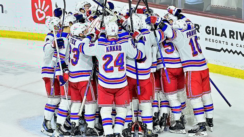 The New York Rangers celebrate after beating the Arizona Coyotes at Mullett Arena
