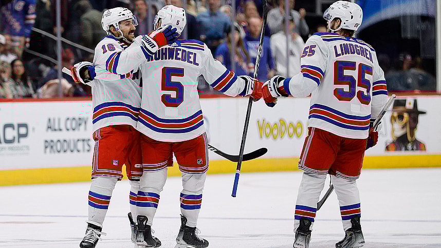 New York Rangers center Vincent Trocheck (16) celebrates with defenseman Chad Ruhwedel (5) and defenseman Ryan Lindgren (55) after the game against the Colorado Avalanche at Ball Arena