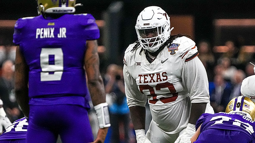 Texas Longhorns defensive lineman T'Vondre Sweat (93) watches Washington quarterback Michael Penix Jr. (9) before a snap during the Sugar Bowl College Football Playoff  semifinals game at the Caesars Superdome (New York Giants)