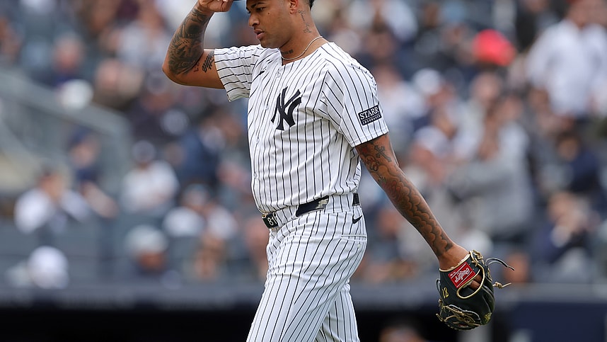 New York Yankees starting pitcher Luis Gil (81) adjusts his cap as he walks off the field after being taken out of the game during the sixth inning against the Tampa Bay Rays at Yankee Stadium