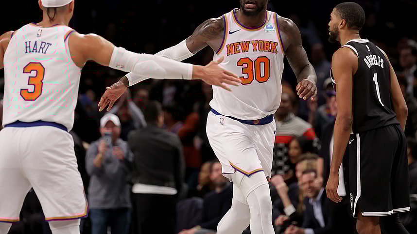 New York Knicks forward Julius Randle (30) high fives guard Josh Hart (3) in front of Brooklyn Nets forward Mikal Bridges (1) during the fourth quarter at Barclays Center