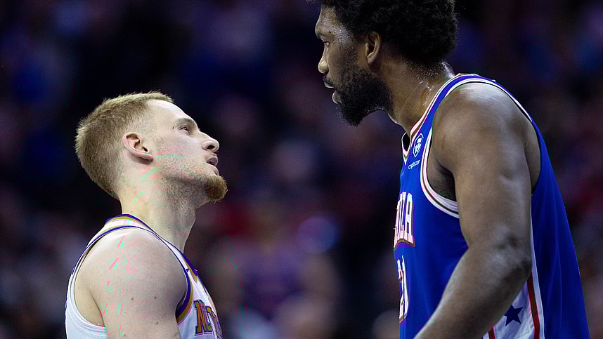 Apr 25, 2024; Philadelphia, Pennsylvania, USA; Philadelphia 76ers center Joel Embiid (21) has words with New York Knicks guard Donte DiVincenzo (L) after a play during the first quarter of game three of the first round for the 2024 NBA playoffs at Wells Fargo Center. Mandatory Credit: Bill Streicher-USA TODAY Sports