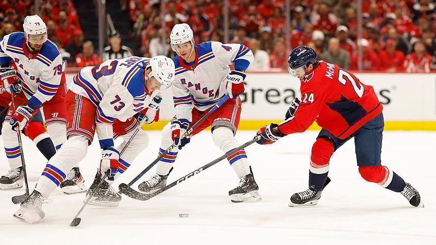Apr 26, 2024; Washington, District of Columbia, USA; New York Rangers center Matt Rempe (73) and Washington Capitals center Connor McMichael (24) battle for the puck in the first period in game three of the first round of the 2024 Stanley Cup Playoffs at Capital One Arena. Mandatory Credit: Geoff Burke-USA TODAY Sports