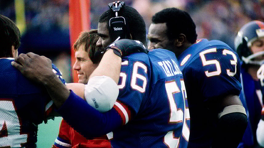 Jan 4, 1987; E. Rutherford, NJ, USA; FILE PHOTO; New York Giants linebacker Lawrence Taylor (56) and Harry Carson (53) on the sideline with assistant coach Bill Belichick during the 1986 NFC Divisional Playoff Game at Giants Stadium. Mandatory Credit: Malcolm Emmons-USA TODAY Sports