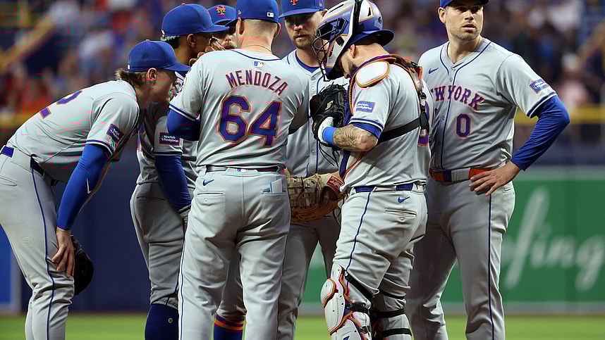 May 4, 2024; St. Petersburg, Florida, USA; New York Mets manager Carlos Mendoza (64) comes out to the mound to talk with pitcher Adam Ottavino (0), catcher Tomas Nido (3), first base Pete Alonso (20), shortstop Francisco Lindor (12) and third base Brett Baty (22) against the Tampa Bay Rays during the eighth inning at Tropicana Field. Mandatory Credit: Kim Klement Neitzel-USA TODAY Sports