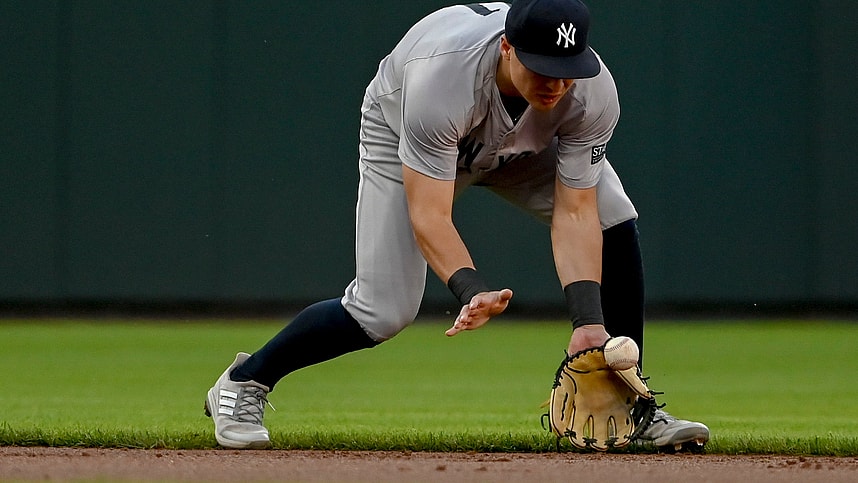 May 1, 2024; Baltimore, Maryland, USA; New York Yankees shortstop Anthony Volpe (11) fields a ground ball during the first inning against the Baltimore Orioles at Oriole Park at Camden Yards. Mandatory Credit: Tommy Gilligan-USA TODAY Sports