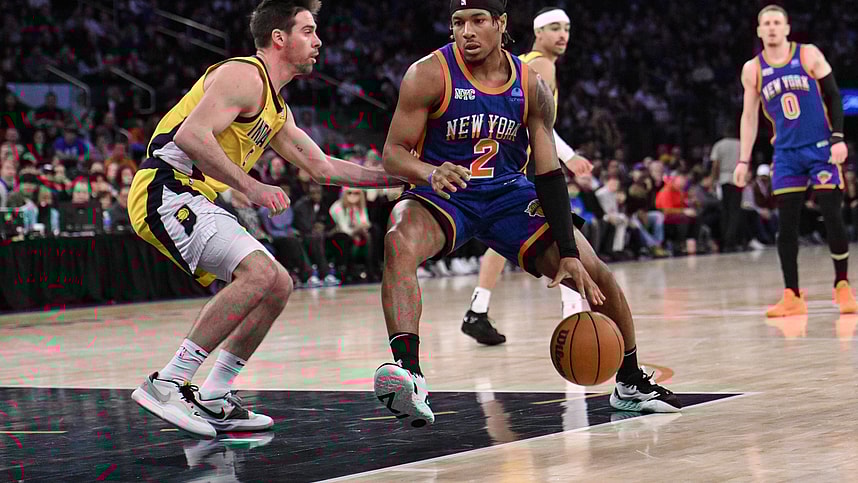 Feb 10, 2024; New York, New York, USA; New York Knicks guard Miles McBride (2) drives to the basket while being defended by Indiana Pacers guard T.J. McConnell (9) during the third quarter at Madison Square Garden. Mandatory Credit: John Jones-USA TODAY Sports