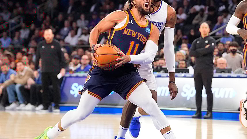 Nov 6, 2023; New York, New York, USA;  New York Knicks point guard Jalen Brunson (11) drives the ball towards the basket against Los Angeles Clipper forward Paul George (13) during the first quarter at Madison Square Garden. Mandatory Credit: Gregory Fisher-USA TODAY Sports