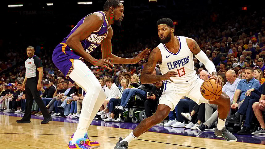 Apr 9, 2024; Phoenix, Arizona, USA; (New York Knicks) LA Clippers forward Paul George (13) handles the ball against Phoenix Suns forward Kevin Durant (35) during the first quarter at Footprint Center. Mandatory Credit: Mark J. Rebilas-USA TODAY Sports