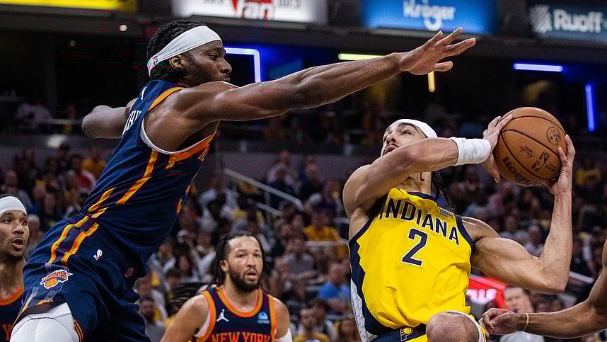 May 12, 2024; Indianapolis, Indiana, USA; Indiana Pacers guard Andrew Nembhard (2) shoots the ball while New York Knicks forward Precious Achiuwa (5) defends during game four of the second round for the 2024 NBA playoffs at Gainbridge Fieldhouse. Mandatory Credit: Trevor Ruszkowski-USA TODAY Sports