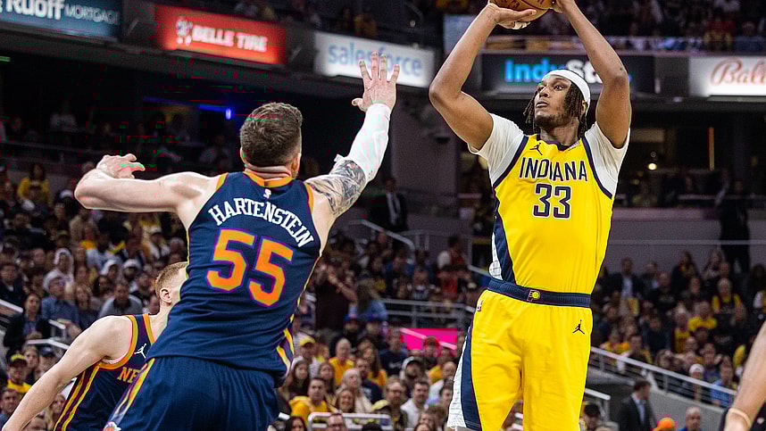 May 12, 2024; Indianapolis, Indiana, USA; Indiana Pacers center Myles Turner (33) shoots the ball while New York Knicks center Isaiah Hartenstein (55) defends during game four of the second round for the 2024 NBA playoffs at Gainbridge Fieldhouse. Mandatory Credit: Trevor Ruszkowski-USA TODAY Sports