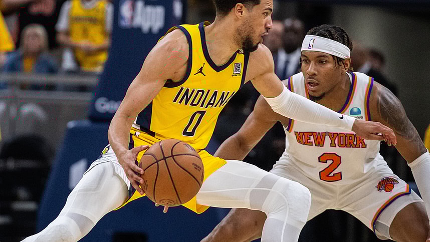 May 17, 2024; Indianapolis, Indiana, USA; Indiana Pacers guard Tyrese Haliburton (0) dribbles the ball while New York Knicks guard Miles McBride (2) defends during game six of the second round for the 2024 NBA playoffs at Gainbridge Fieldhouse. Mandatory Credit: Trevor Ruszkowski-USA TODAY Sports