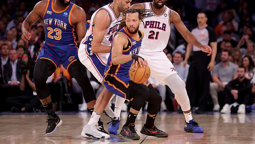 Apr 30, 2024; New York, New York, USA; New York Knicks guard Jalen Brunson (11) handles the ball against Philadelphia 76ers forward Nicolas Batum (40) and center Joel Embiid (21) during the first quarter of game 5 of the first round of the 2024 NBA playoffs at Madison Square Garden. Mandatory Credit: Brad Penner-USA TODAY Sports
