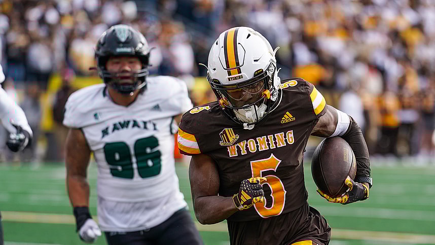 Nov 18, 2023; Laramie, Wyoming, USA; Wyoming Cowboys wide receiver Ayir Asante (New York Giants) (5) scores a touchdown against the Hawaii Rainbow Warriors during the second quarter at Jonah Field at War Memorial Stadium. Mandatory Credit: Troy Babbitt-USA TODAY Sports