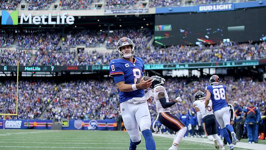 Oct 2, 2022; East Rutherford, New Jersey, USA; New York Giants quarterback Daniel Jones (8) runs for a touchdown against the Chicago Bears during the second quarter at MetLife Stadium. Mandatory Credit: Brad Penner-USA TODAY Sports