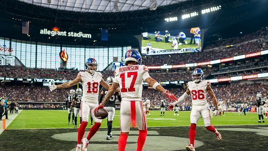 November 5, 2023; Paradise, Nevada, USA; New York Giants wide receiver Wan'Dale Robinson (17) is congratulated by wide receiver Isaiah Hodgins (18) and wide receiver Darius Slayton (86) for scoring a touchdown against the Las Vegas Raiders during the fourth quarter at Allegiant Stadium. Mandatory Credit: Kyle Terada-USA TODAY Sports