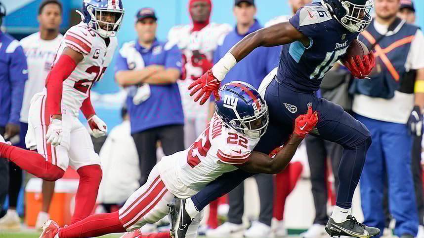 Sep 11, 2022; Nashville, Tennessee, USA; Tennessee Titans wide receiver Treylon Burks (16) picks up a first down as New York Giants cornerback Adoree' Jackson (22) tries to tackle him during the third quarter at Nissan Stadium. Mandatory Credit: George Walker IV-USA TODAY Sports