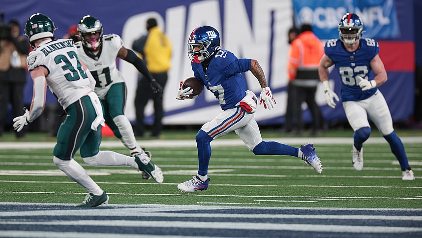 Jan 7, 2024; East Rutherford, New Jersey, USA; New York Giants wide receiver Wan'Dale Robinson (17) gains yards after catch asPhiladelphia Eagles safety Reed Blankenship (32) pursues during the first quarter at MetLife Stadium. Mandatory Credit: Vincent Carchietta-USA TODAY Sports