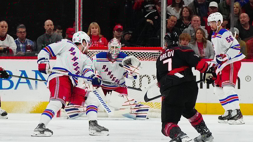 Mar 12, 2024; Raleigh, North Carolina, USA; Carolina Hurricanes defenseman Dmitry Orlov (7) takes a shot against the New York Rangers during the second period at PNC Arena. Mandatory Credit: James Guillory-USA TODAY Sports