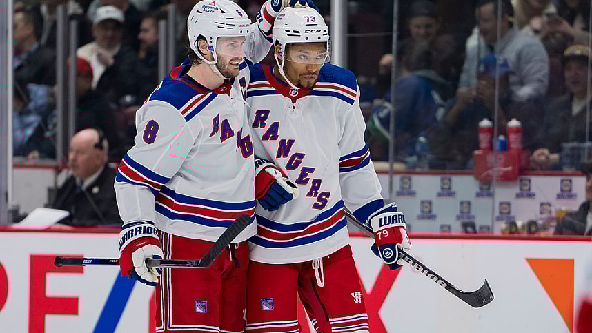 Feb 15, 2023; Vancouver, British Columbia, CAN; New York Rangers defenseman Jacob Trouba (8) celebrates defenseman K'Andre Miller (79) goal against the Vancouver Canucks in the second period at Rogers Arena. Mandatory Credit: Bob Frid-USA TODAY Sports