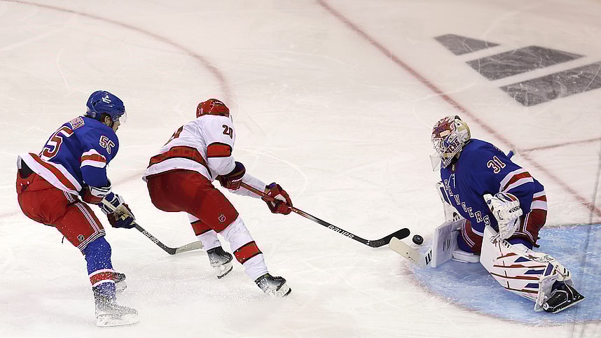 May 7, 2024; New York, New York, USA; Carolina Hurricanes center Sebastian Aho (20) takes a shot against New York Rangers goaltender Igor Shesterkin (31) in front of Rangers defenseman Ryan Lindgren (55) during the first overtime of game two of the second round of the 2024 Stanley Cup Playoffs at Madison Square Garden. Mandatory Credit: Brad Penner-USA TODAY Sports